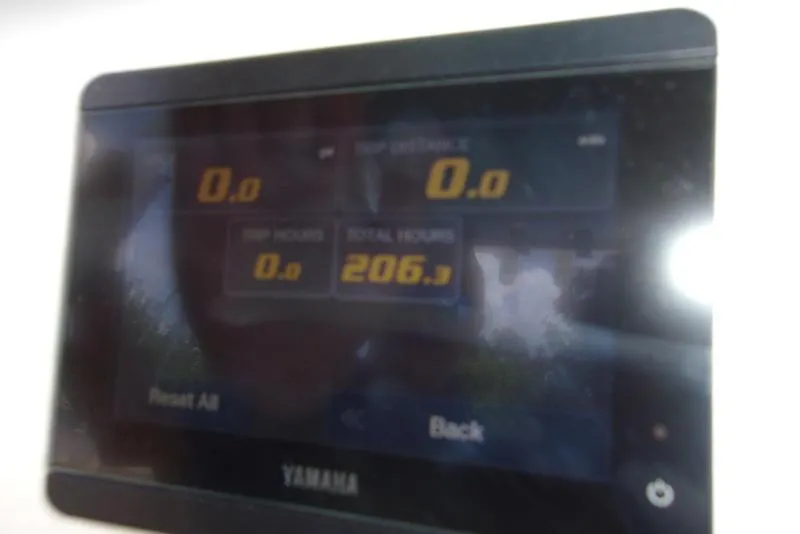 Slide: The Image of Yamaha display screen on 2022 Key West 239FS boat showing trip and total hours. - 3