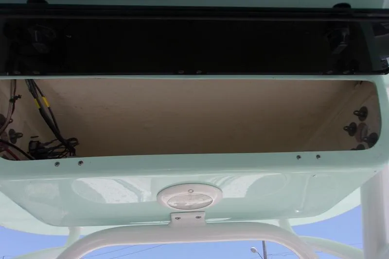 Slide: The Image of 2022 Key West 239FS boat storage compartment with wiring. - 5
