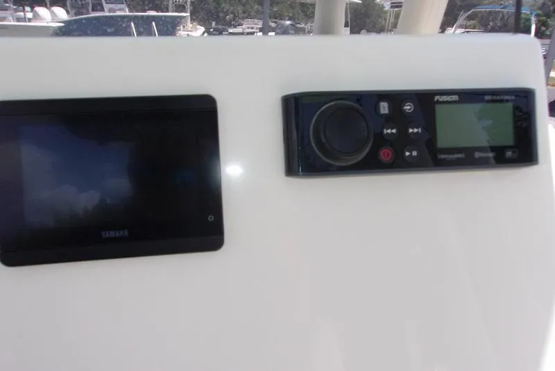 Slide: The Image of 2022 Key West 239FS boat dashboard with Yamaha and Fusion electronics. - 8