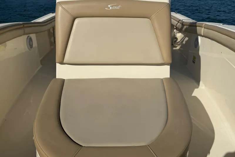 Slide: The Image of 2021 Scout 215 XSF boat seat with beige upholstery on open water. - 19