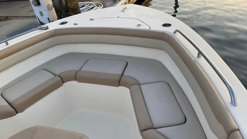 Slide: The Image of 2021 Scout 215 XSF boat interior with cushioned seating and sleek design. - 30