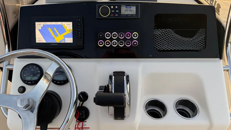 Slide: The Image of 2021 Scout 215 XSF boat dashboard with navigation system and controls. - 35