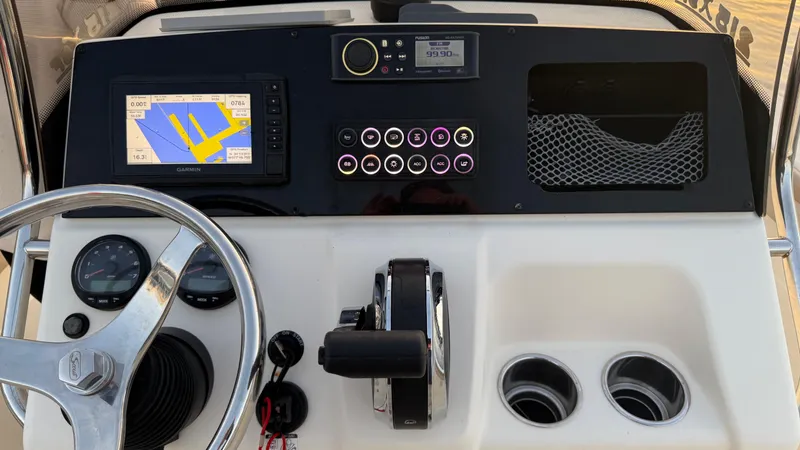 Slide: The Image of 2021 Scout 215 XSF boat dashboard with navigation system and controls. - 36