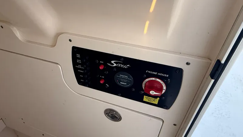 Slide: The Image of Control panel of 2021 Scout 215 XSF boat, featuring switches and indicators. - 45