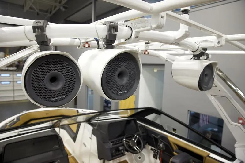 Slide: The Image of 2024 Cobalt R4 Surf boat with mounted speakers, interior view. - 10