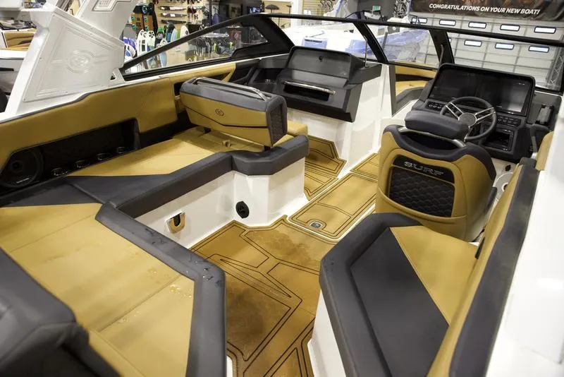 Slide: The Image of Interior of 2024 Cobalt R4 Surf boat with luxurious seating and modern dashboard. - 13