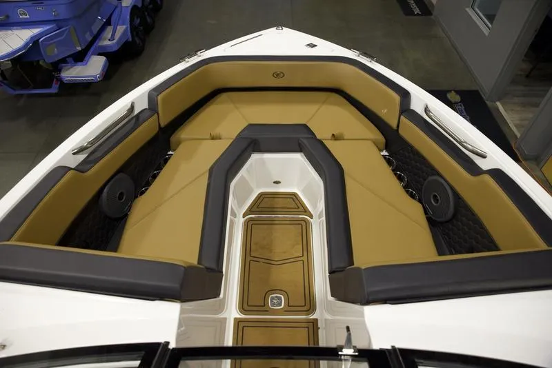 Slide: The Image of 2024 Cobalt R4 Surf boat interior with tan and black seating. - 14