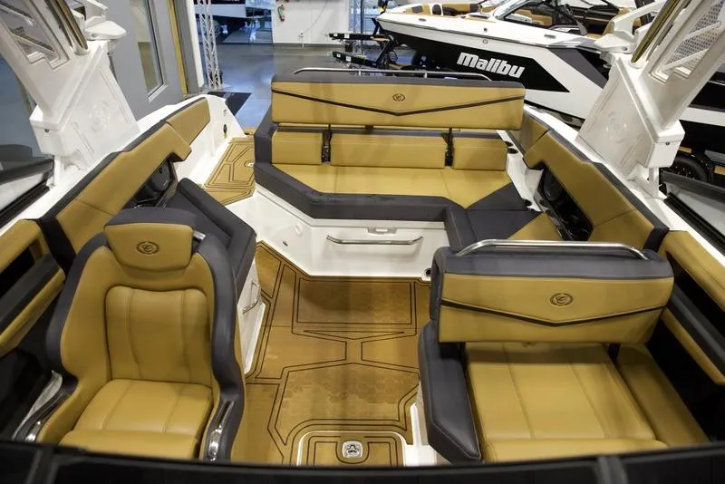 Slide: The Image of 2024 Cobalt R4 Surf boat interior with tan and black seating. - 16