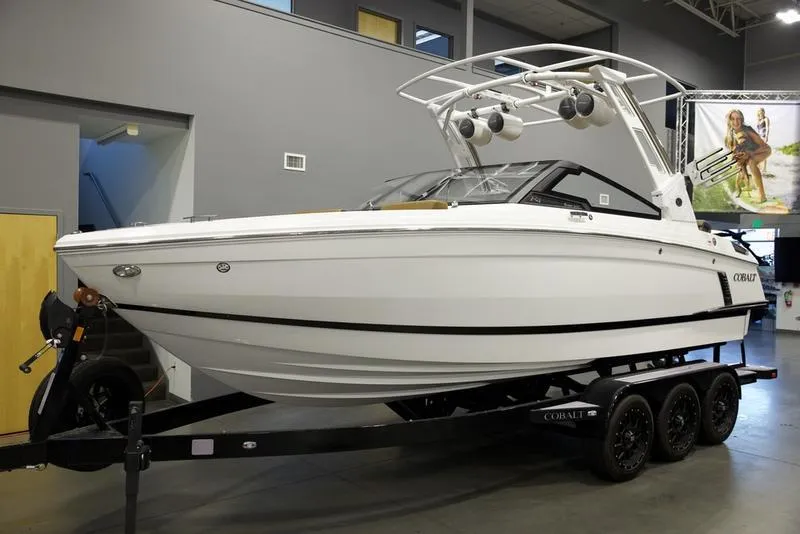 Slide: The Image of 2024 Cobalt R4 Surf boat on trailer in showroom. - 3
