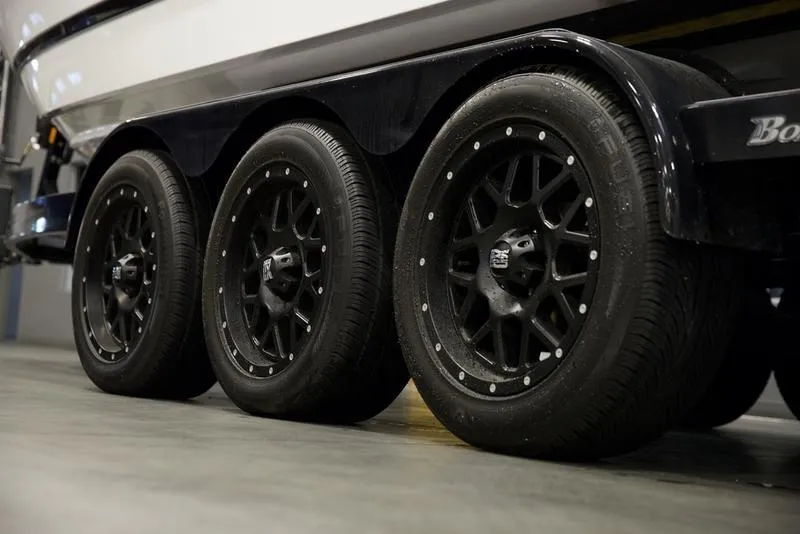 Slide: The Image of 2024 Cobalt R4 Surf trailer with black alloy wheels, side view. - 5