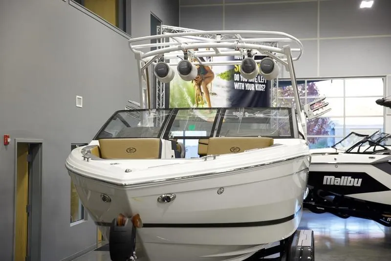 Slide: The Image of 2024 Cobalt R4 Surf boat displayed indoors, featuring sleek design and modern amenities. - 7
