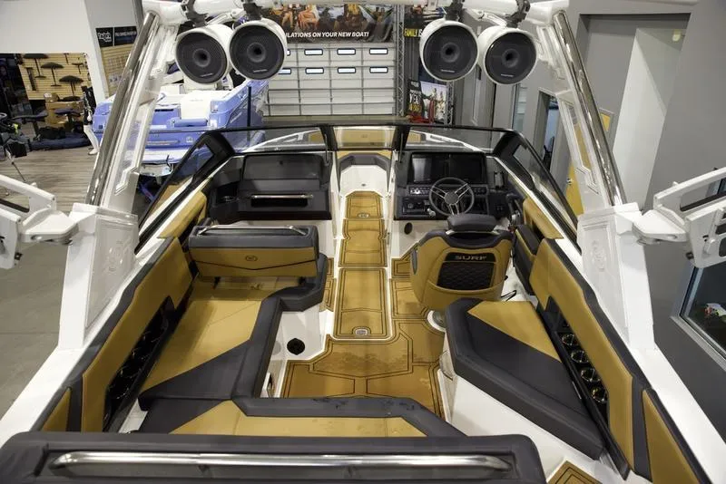 Slide: The Image of 2024 Cobalt R4 Surf boat interior with premium seating and advanced audio system. - 9