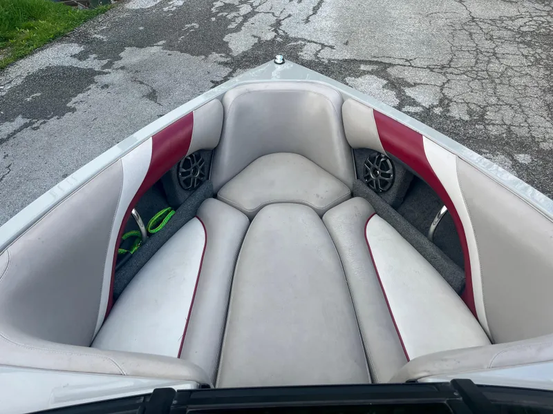 Slide: The Image of 2008 Malibu 21 vRide boat interior with white and red seating. - 12