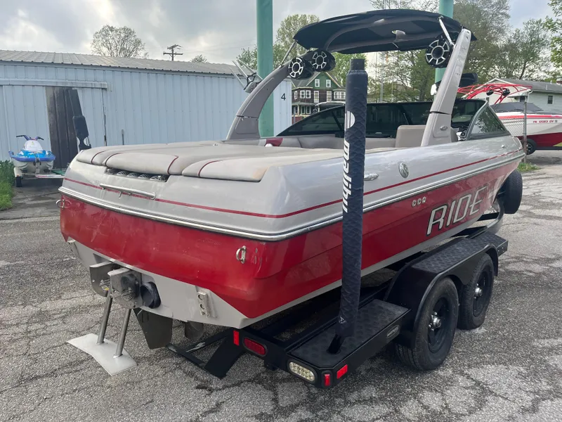 Slide: The Image of 2008 Malibu 21 vRide boat on trailer, red and white, rear view. - 7