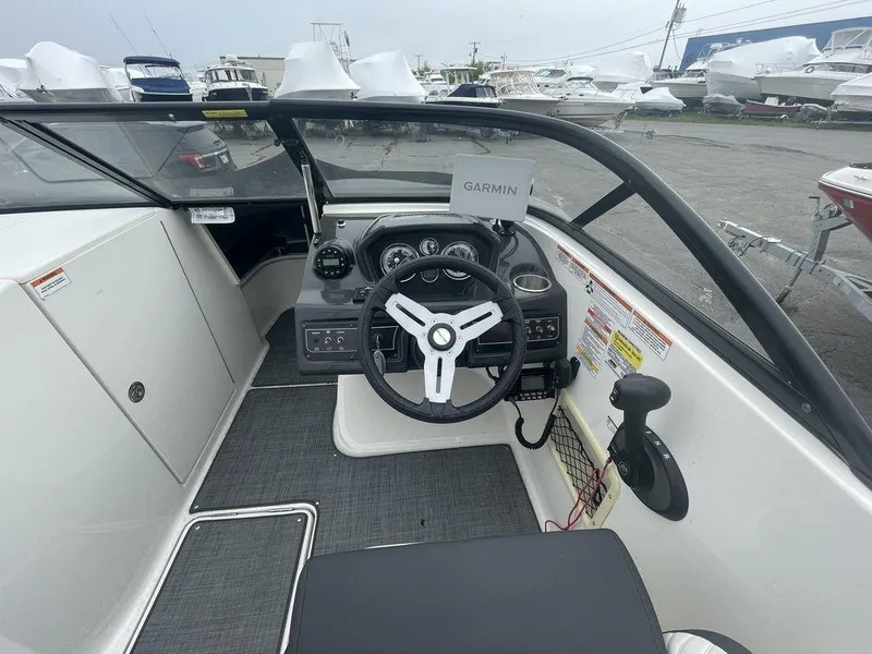 Slide: The Image of 2021 Bayliner VR6 OB boat cockpit with Garmin navigation system. - 11