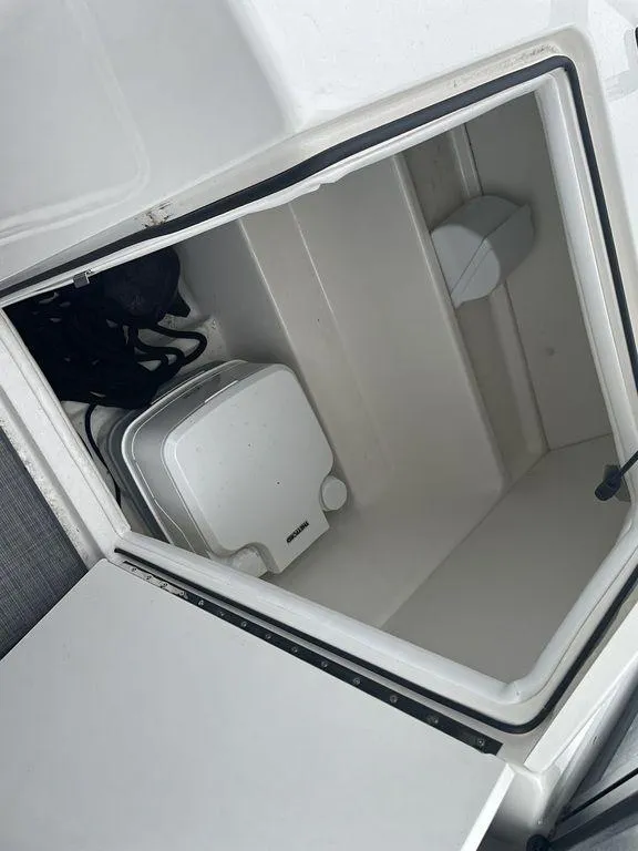 Slide: The Image of Storage compartment of a 2021 Bayliner VR6 OB boat. - 12