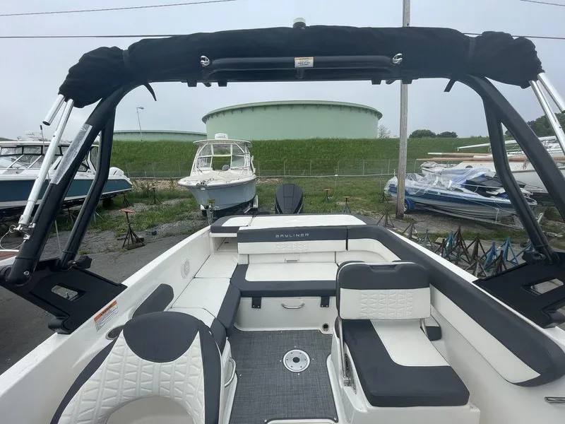 Slide: The Image of 2021 Bayliner VR6 OB boat interior with seating and storage. - 15