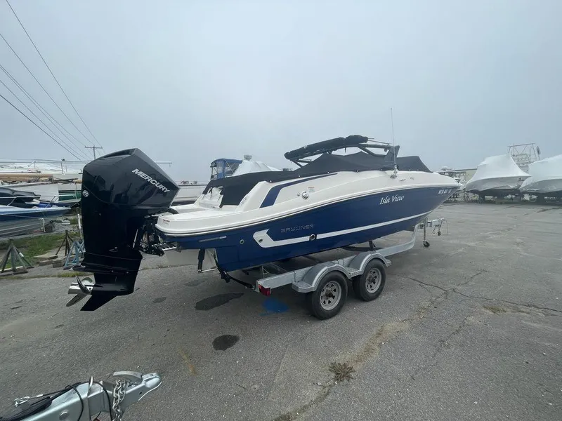 Slide: The Image of 2021 Bayliner VR6 OB boat on a trailer in a marina. - 6