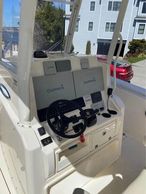 Slide: The Image of 2019 Cobia 301CC boat cockpit with Garmin navigation system. - 4