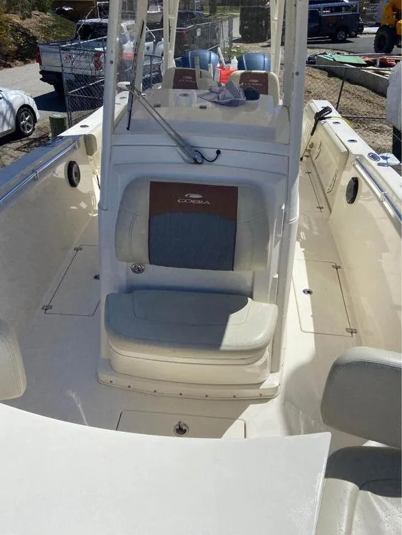 Slide: The Image of 2019 Cobia 301CC center console boat with seating and helm station. - 9