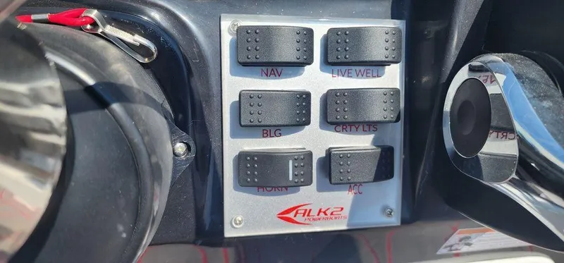 Slide: The Image of Control panel of 2024 ALK2 Powerboats 17 HS with labeled switches. - 18