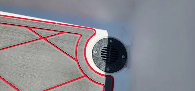 Slide: The Image of ALK2 Powerboats 17 HS 2024 deck detail with red trim and drainage vent. - 23