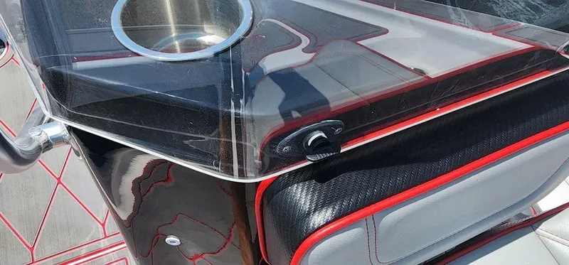 Slide: The Image of 2024 ALK2 Powerboats 17 HS console with sleek design and red accents. - 26