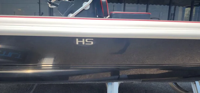 Slide: The Image of 2024 ALK2 Powerboats 17 HS, sleek black hull with red accents. - 4