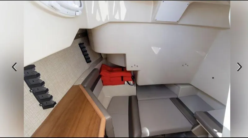 Slide: The Image of Interior of 2021 Cutwater C-24W boat with seating and storage area. - 12