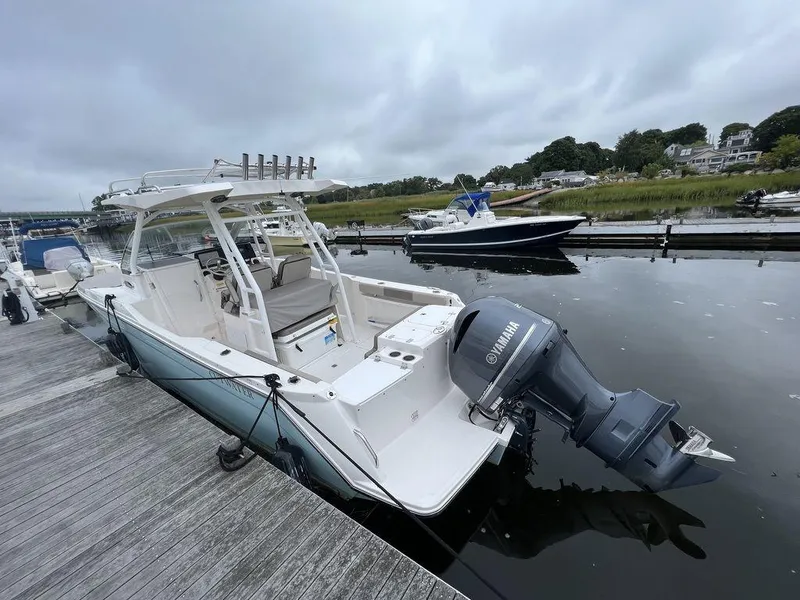 Slide: The Image of 2021 Cutwater C-24W boat docked with Yamaha outboard motor. - 5
