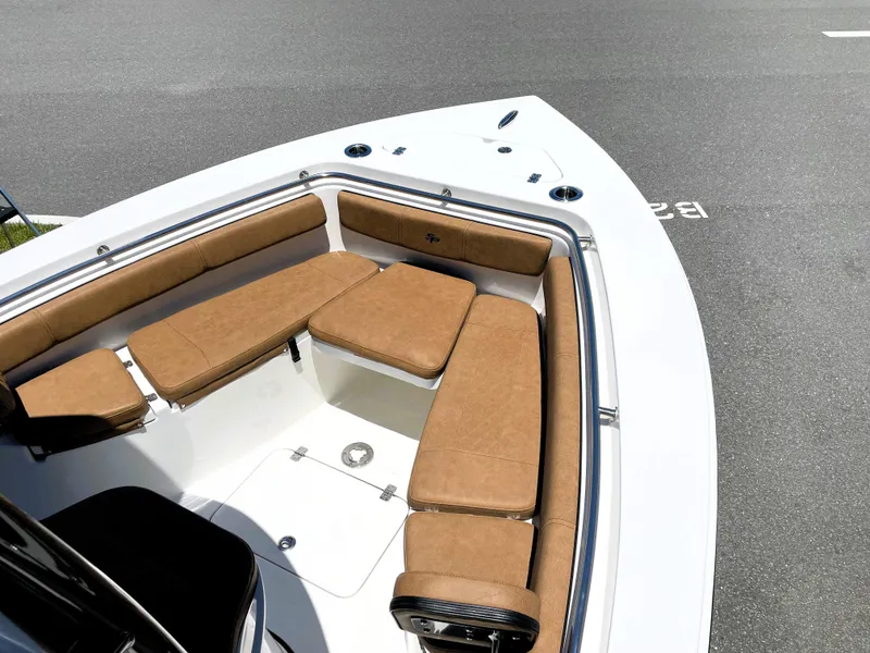 Slide: The Image of 2022 Sea Pro 219 Center Console boat with tan cushioned seating. - 21