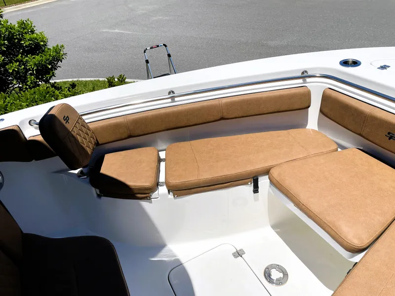 Slide: The Image of 2022 Sea Pro 219 Center Console boat with tan cushioned seating. - 24
