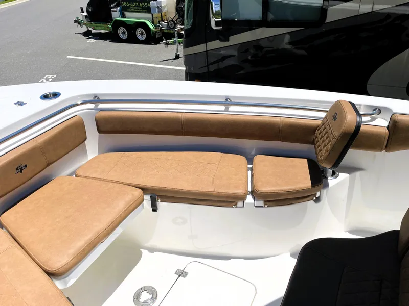 Slide: The Image of 2022 Sea Pro 219 Center Console boat with tan cushioned seating. - 25