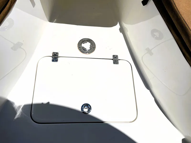 Slide: The Image of 2022 Sea Pro 219 Center Console boat deck with storage hatch. - 26