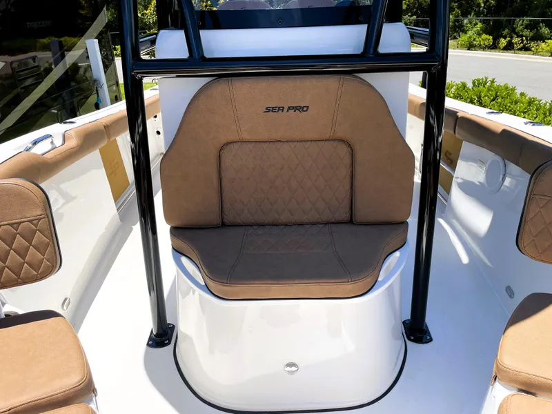 Slide: The Image of 2022 Sea Pro 219 Center Console boat with tan seating and black frame. - 28