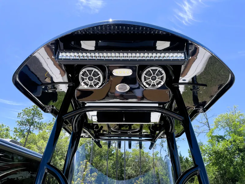 Slide: The Image of 2022 Sea Pro 219 Center Console T-top with speakers and LED lights. - 29