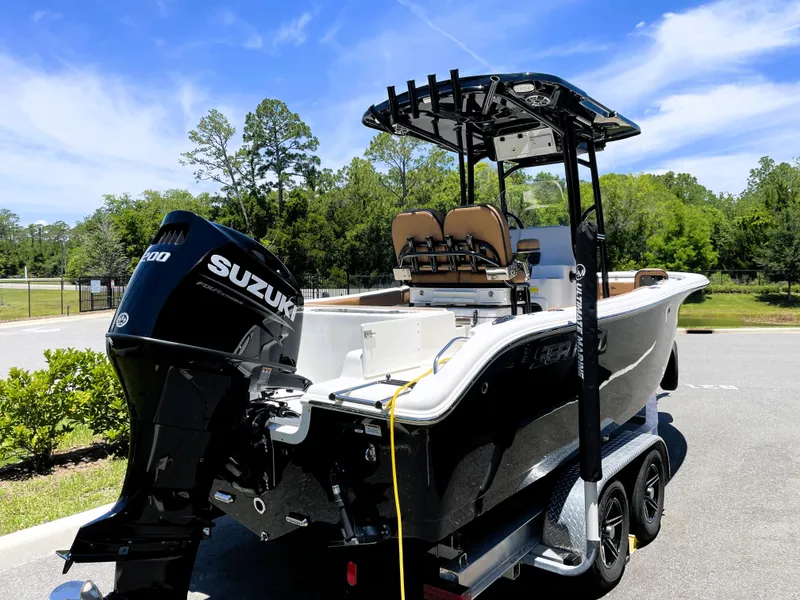 Slide: The Image of 2022 Sea Pro 219 Center Console boat with Suzuki outboard motor on trailer. - 3