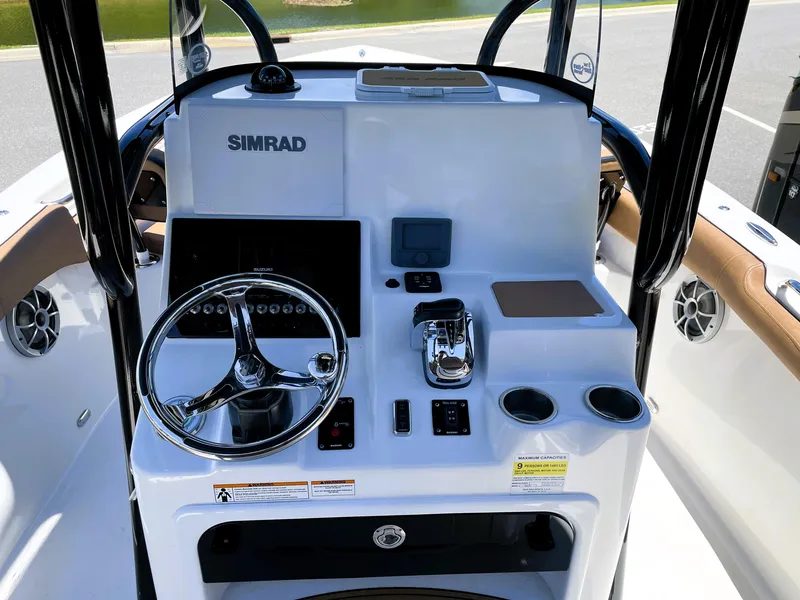 Slide: The Image of 2022 Sea Pro 219 Center Console boat dashboard with Simrad electronics. - 36