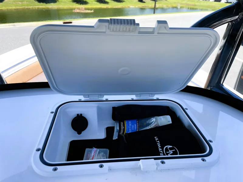 Slide: The Image of Open storage compartment on 2022 Sea Pro 219 Center Console boat. - 38