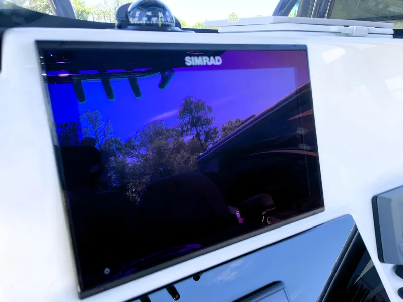 Slide: The Image of Simrad display on 2022 Sea Pro 219 Center Console boat dashboard. - 39