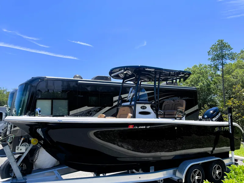 Slide: The Image of 2022 Sea Pro 219 Center Console boat on a trailer, parked outdoors. - 4