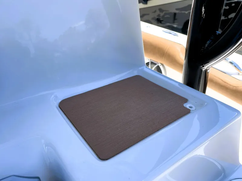 Slide: The Image of 2022 Sea Pro 219 Center Console boat detail with a brown mat on a white surface. - 42