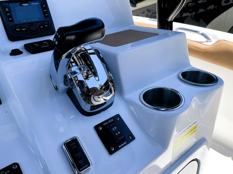 Slide: The Image of 2022 Sea Pro 219 Center Console boat helm with controls and cup holders. - 43