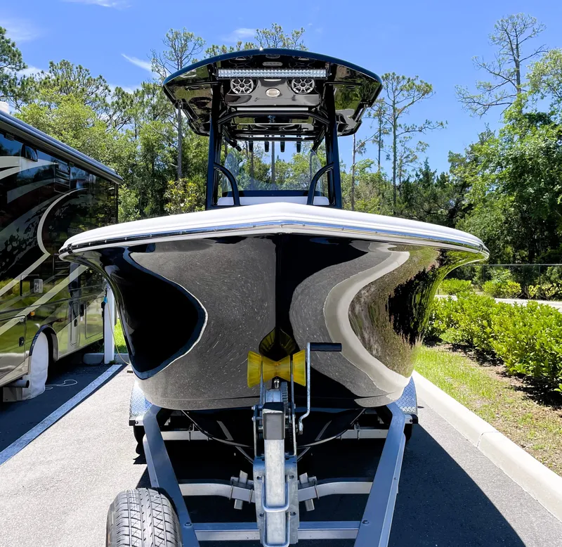 Slide: The Image of 2022 Sea Pro 219 Center Console boat on trailer in parking lot. - 5