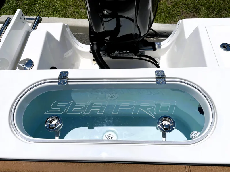 Slide: The Image of 2022 Sea Pro 219 Center Console livewell with clear lid and Sea Pro logo. - 53