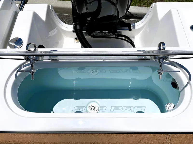 Slide: The Image of 2022 Sea Pro 219 Center Console livewell with clear water and Sea Pro branding. - 54