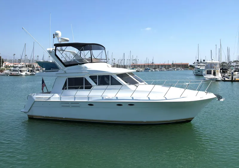 Slide: The Image of 1999 Californian 39 yacht docked in a marina. - 2