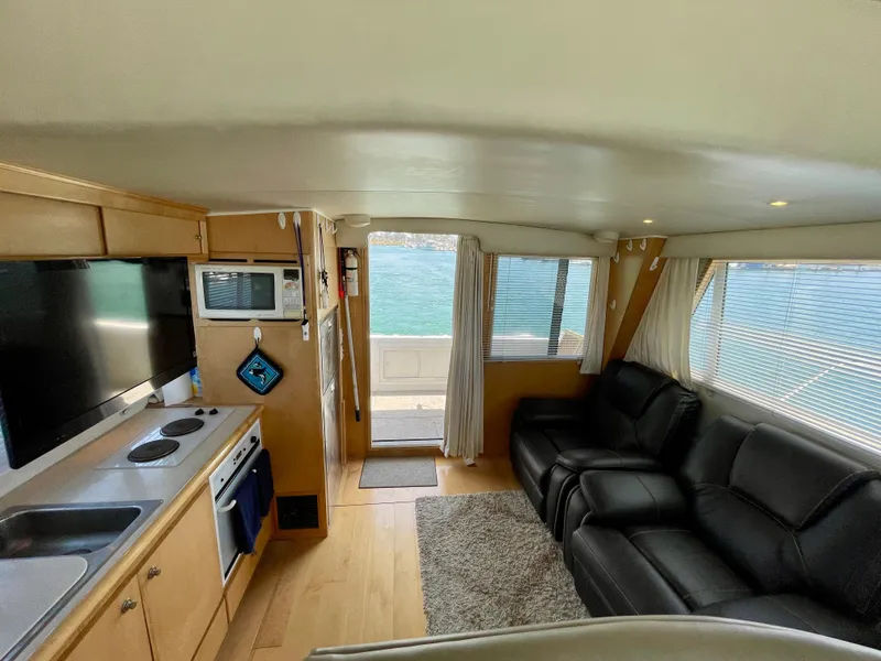 Slide: The Image of Interior of 1999 Californian 39 yacht with modern kitchen and cozy living area. - 22