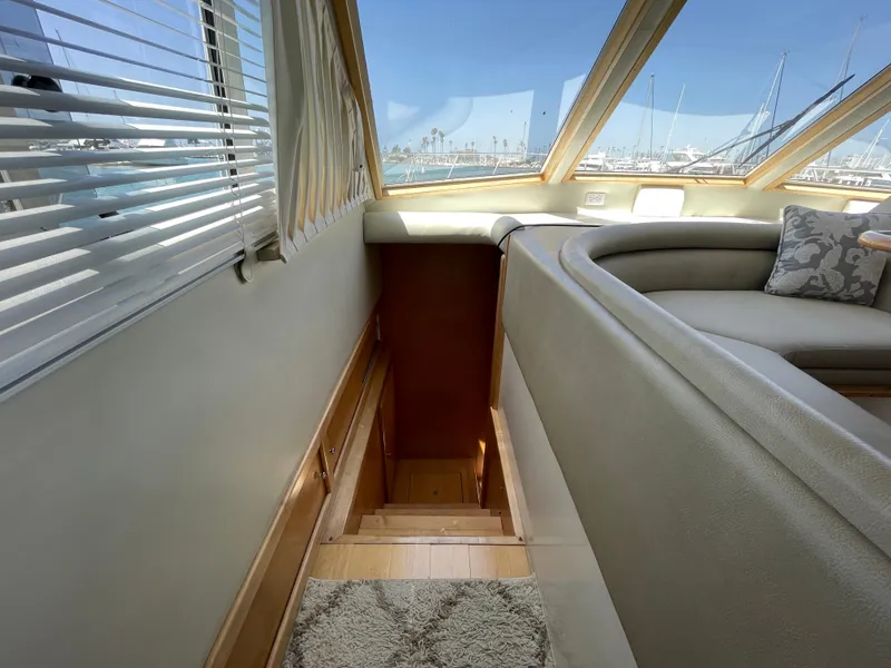 Slide: The Image of Interior of 1999 Californian 39 yacht with stairs and marina view. - 23