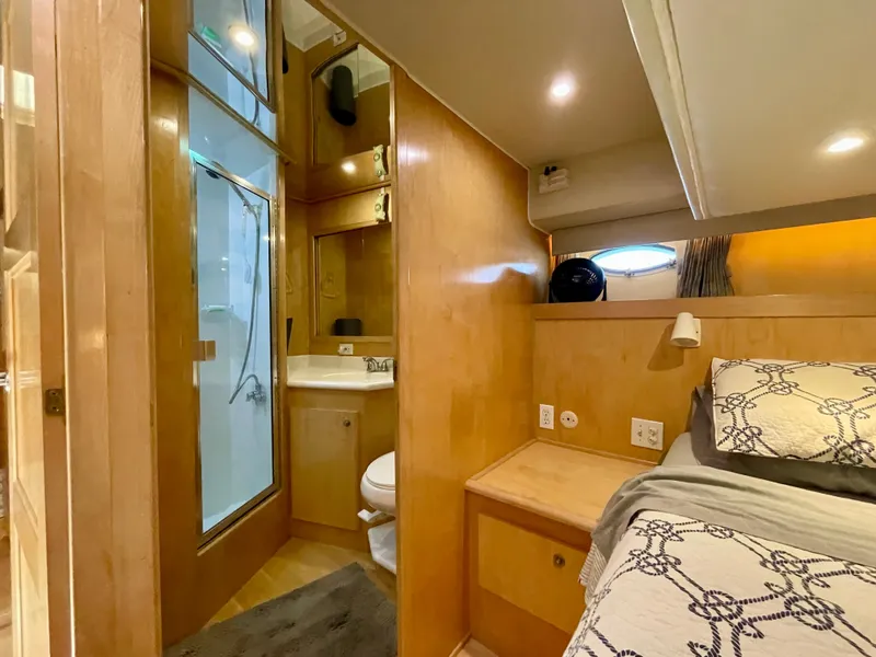 Slide: The Image of 1999 Californian 39 yacht interior with bedroom and bathroom, modern wood finish. - 26